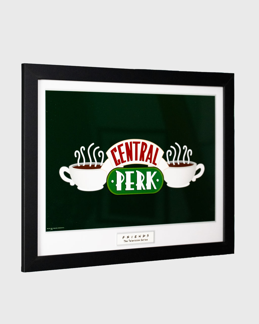 Plakat Central Perk z serialu Friends w czarnej ramie – logo kultowej kawiarni, widok pod kątem