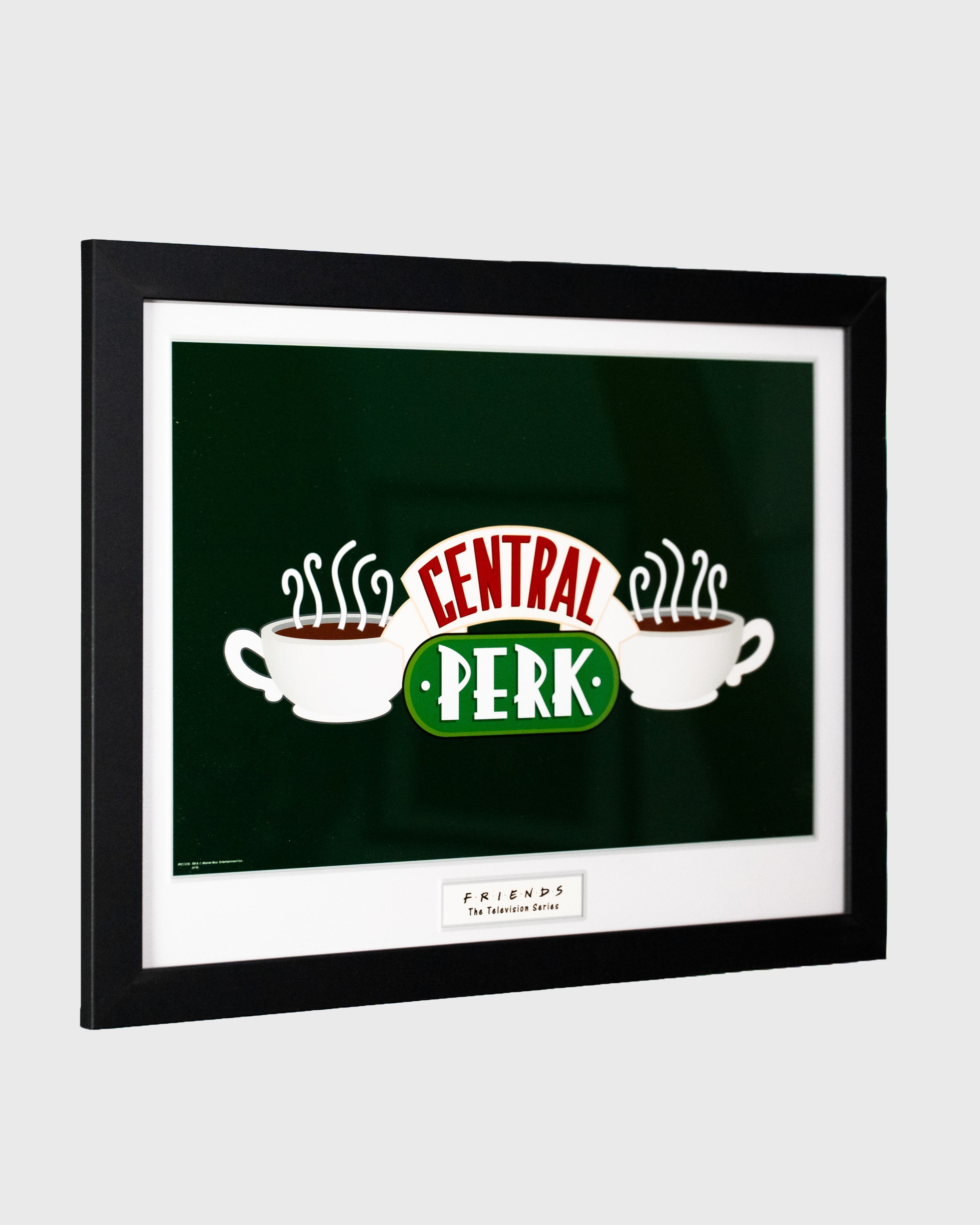 Plakat Central Perk z serialu Friends w czarnej ramie – logo kultowej kawiarni, widok pod kątem