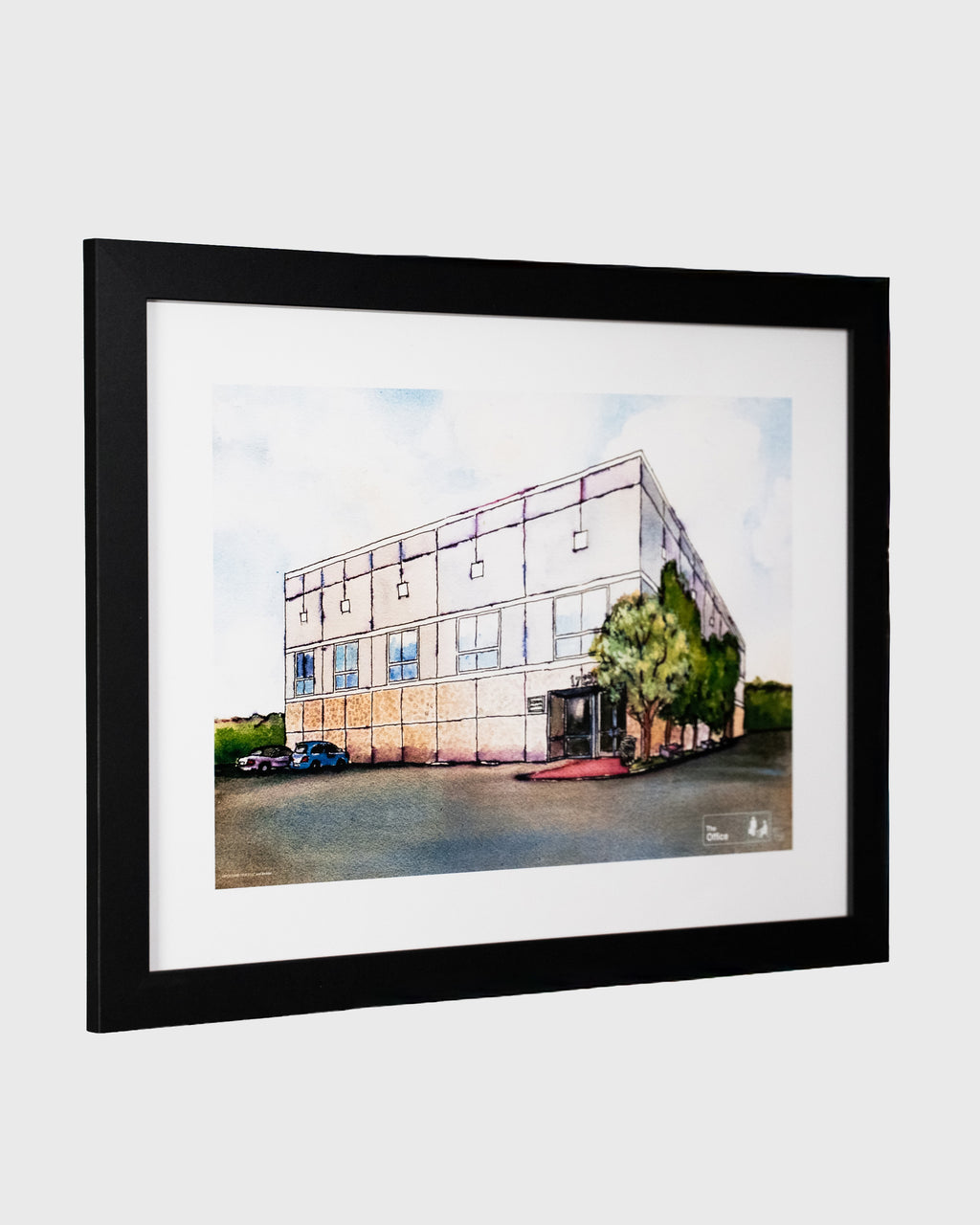 plakat The Office przedstawiający budynek Dunder Mifflin – ilustracja w czarnej ramie, widok perspektywiczny